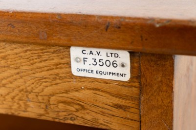 vintage wooden tambour cupboard label close up